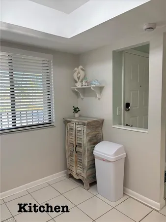 a bathroom with a toilet a sink and a window