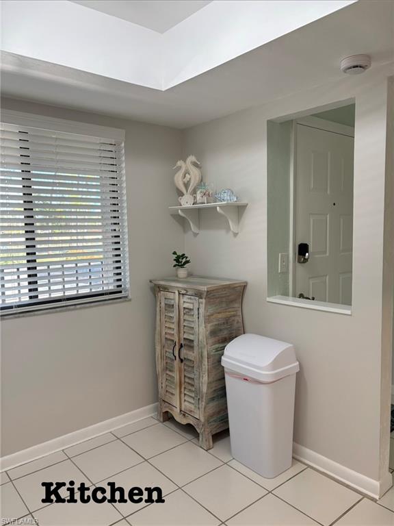 5841 Rattlesnake Hammock Road, Unit I203 Naples, FL 34113 - Photo 11 of 20 a bathroom with a toilet a sink and a window
