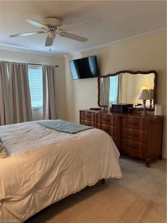 a bedroom with a bed and with furniture