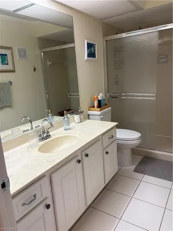 a bathroom with a sink toilet and mirror