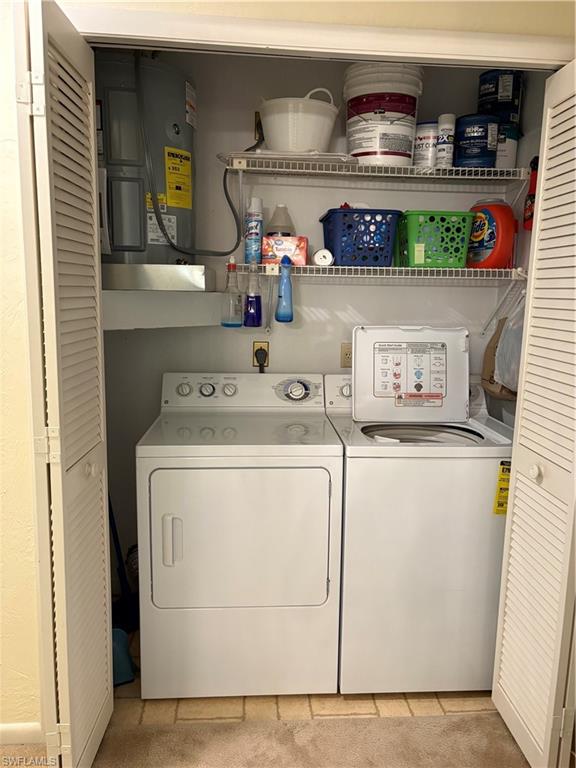 5841 Rattlesnake Hammock Road, Unit I203 Naples, FL 34113 - Photo 17 of 20 a utility room with dryer and washer