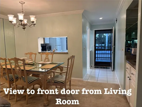 a view of a dining room and a rug