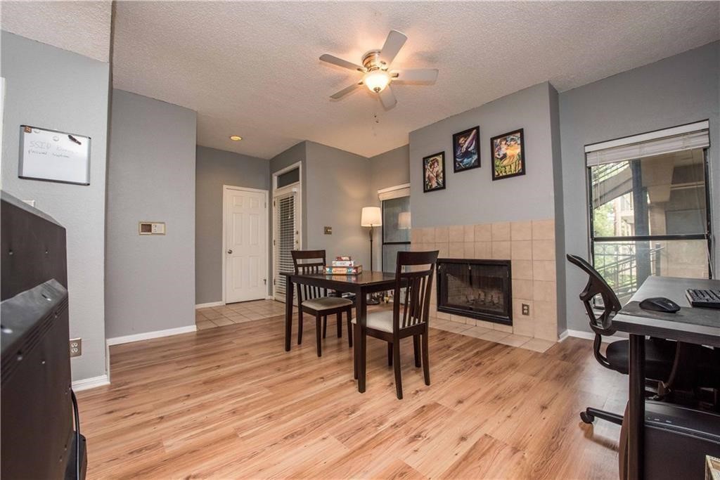 1910 Robbins Place, Unit 210 Austin, TX 78705 - Photo 5 of 13 a view of a livingroom with furniture and a flat screen tv