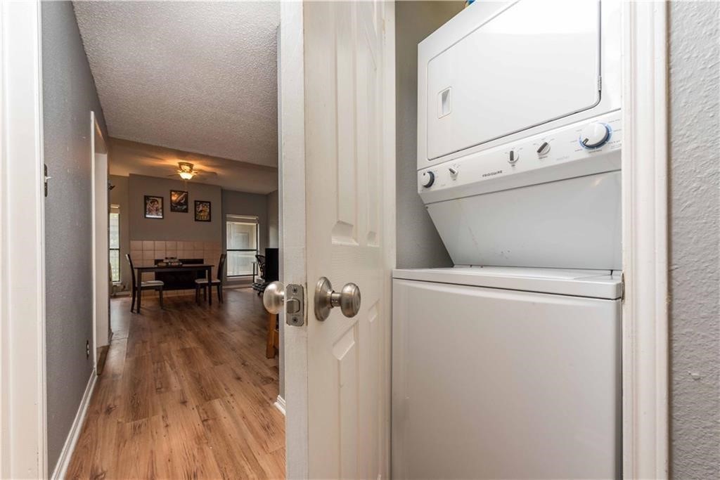1910 Robbins Place, Unit 210 Austin, TX 78705 - Photo 10 of 13 a view of washer and dryer with bathroom in the background