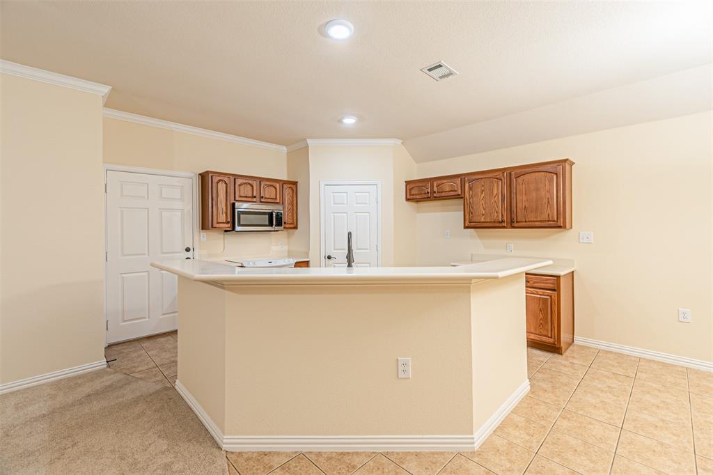 105 Sunglow Loop Red Oak, TX 75154 - Photo 13 of 40 a view of kitchen with stainless steel appliances cabinets