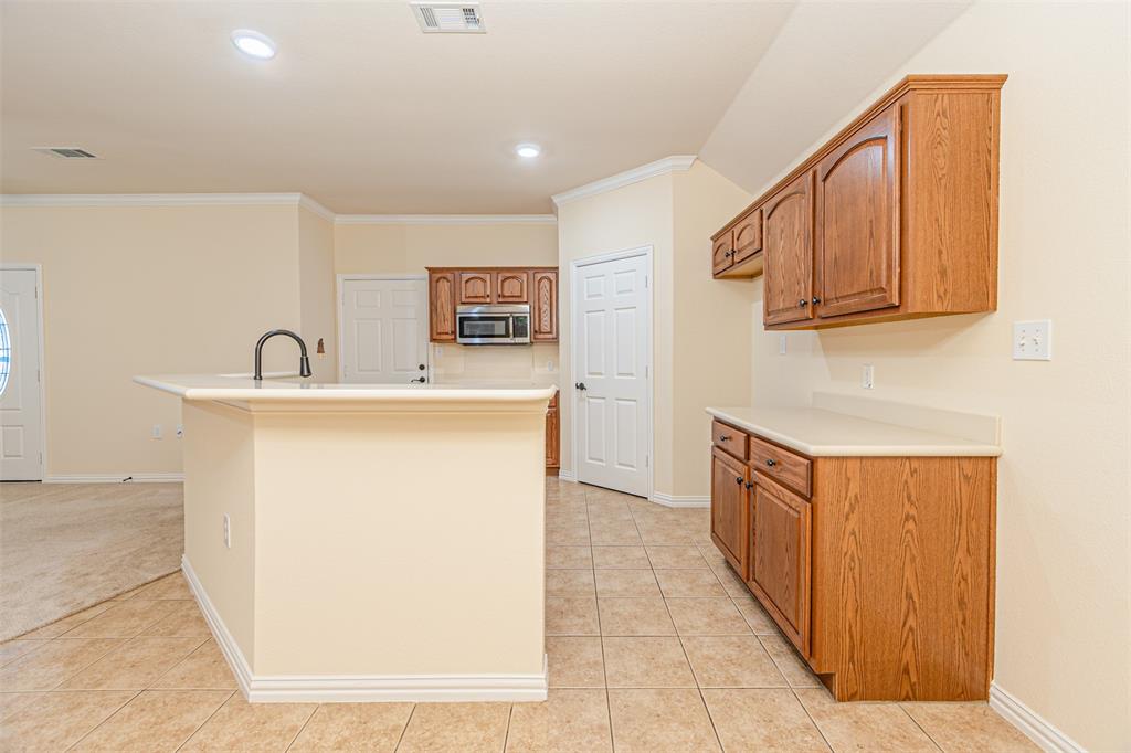 105 Sunglow Loop Red Oak, TX 75154 - Photo 16 of 40 a utility room with cabinets washer and dryer