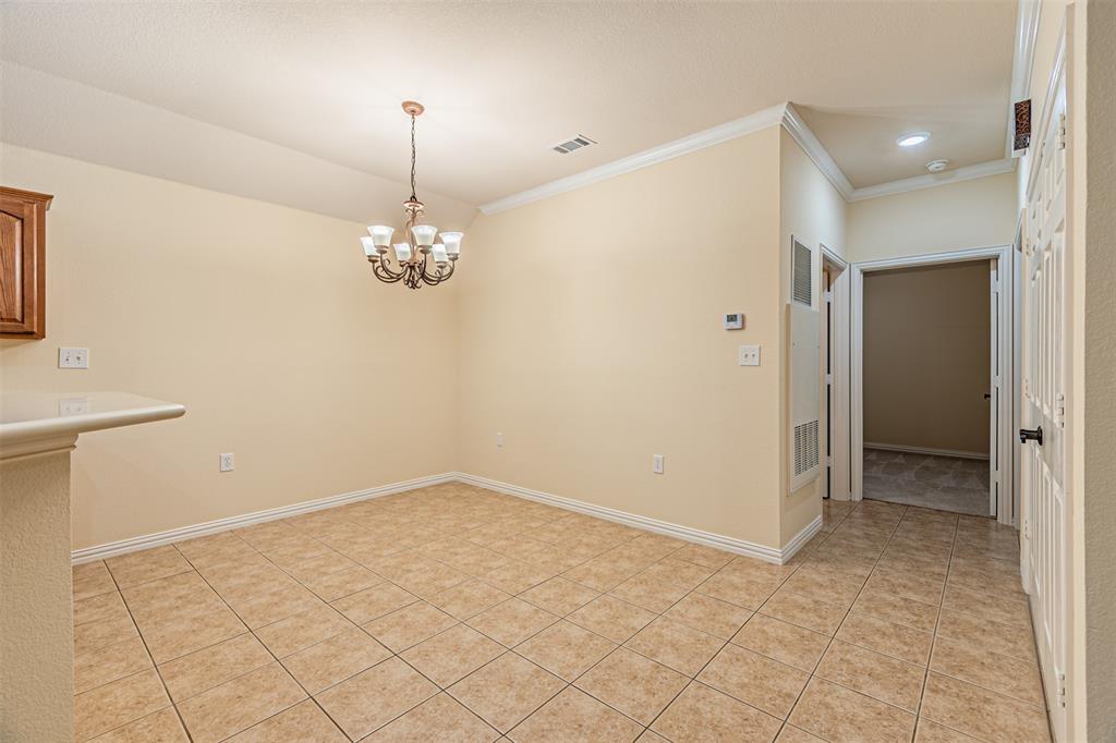 105 Sunglow Loop Red Oak, TX 75154 - Photo 19 of 40 a view of an empty room with chandelier and window