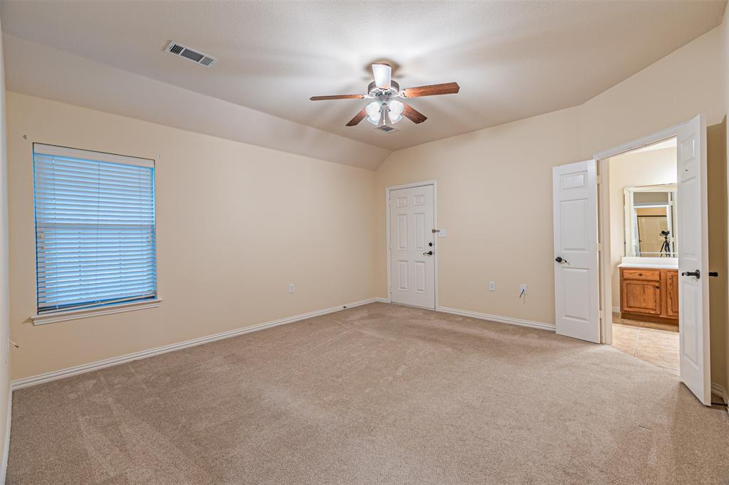 105 Sunglow Loop Red Oak, TX 75154 - Photo 21 of 40 a view of an empty room with a ceiling fan
