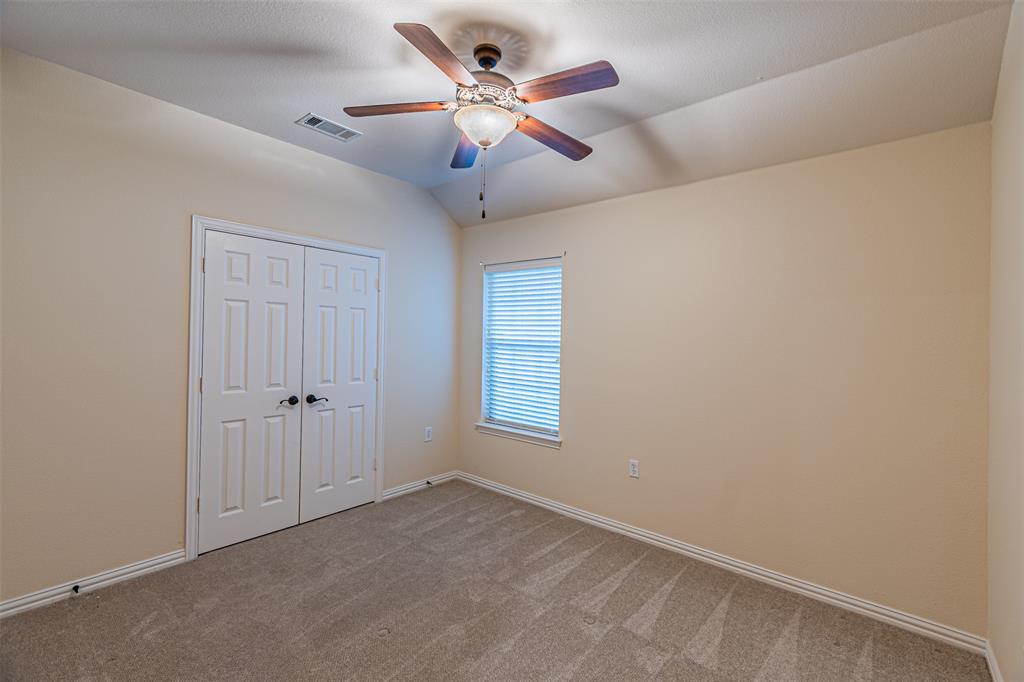 105 Sunglow Loop Red Oak, TX 75154 - Photo 26 of 40 a view of an empty room and a ceiling fan
