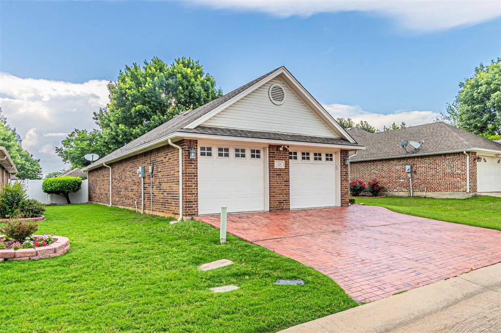 105 Sunglow Loop Red Oak, TX 75154 - Photo 40 of 40 a front view of a house with a yard and garage