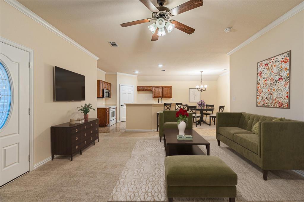 105 Sunglow Loop Red Oak, TX 75154 - Photo 4 of 40 a living room with furniture and a flat screen tv