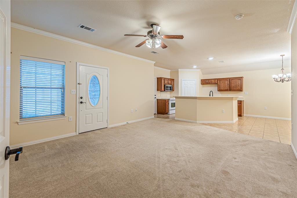 105 Sunglow Loop Red Oak, TX 75154 - Photo 5 of 40 a view of a kitchen with a sink and cabinet area an empty room