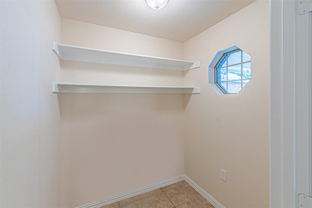 105 Sunglow Loop Red Oak, TX 75154 - Photo 9 of 40 a view of small space with racks on the wall