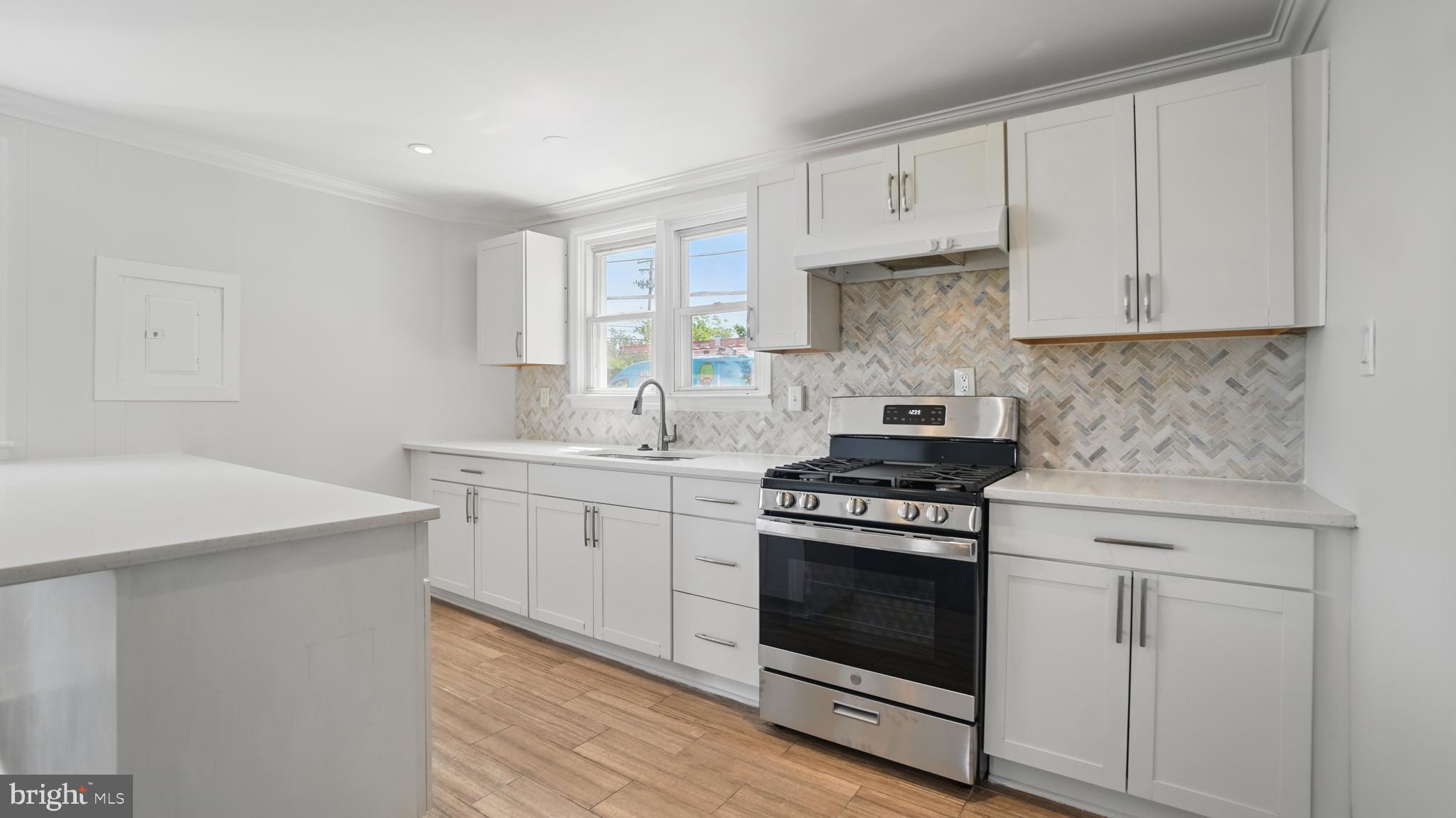 8014 Ritchie Highway Pasadena, MD 21122 - Photo 11 of 38 a kitchen with cabinets appliances and a sink