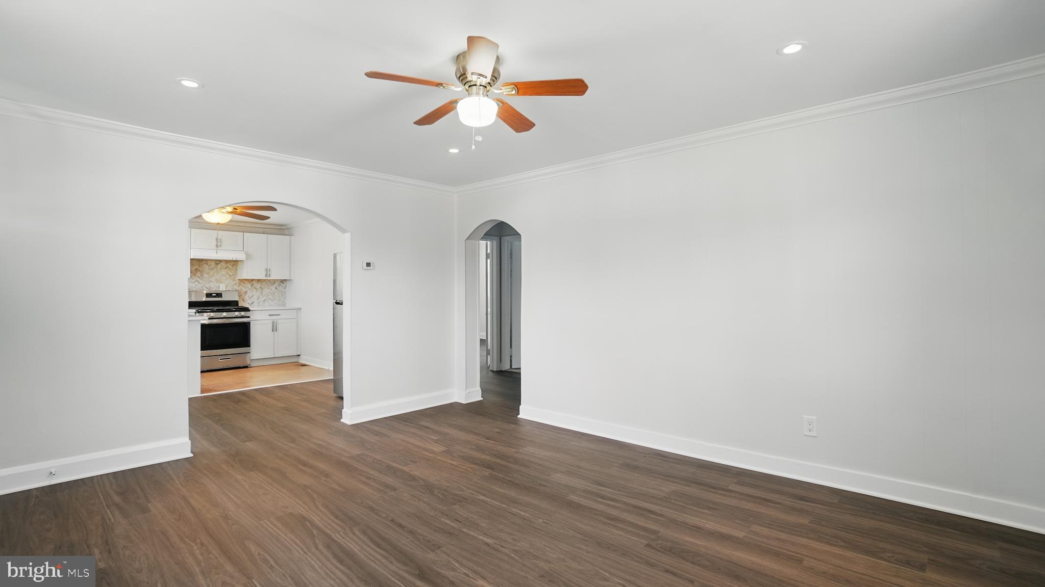 8014 Ritchie Highway Pasadena, MD 21122 - Photo 15 of 38 wooden floor in an empty room with a window