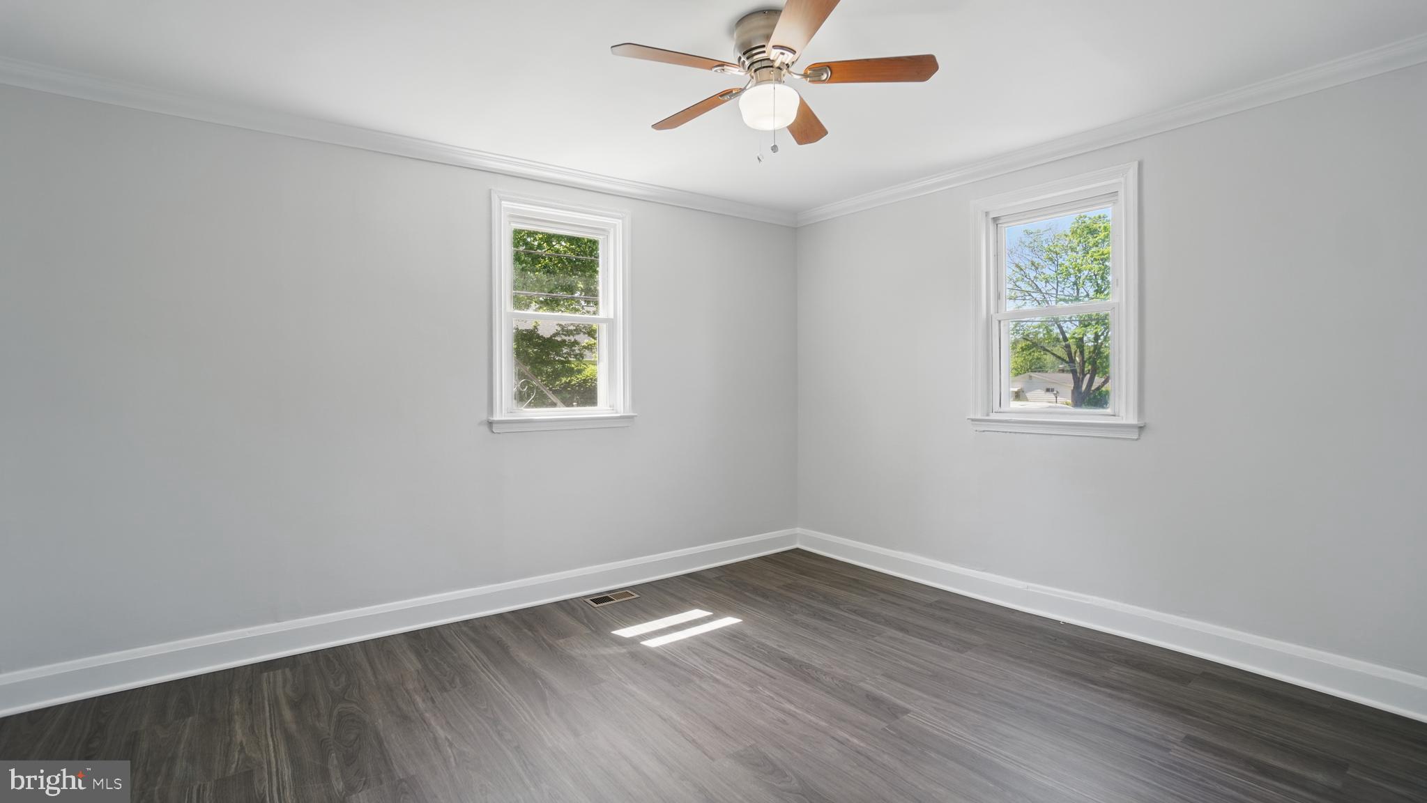 8014 Ritchie Highway Pasadena, MD 21122 - Photo 18 of 38 a view of empty room with wooden floor and fan