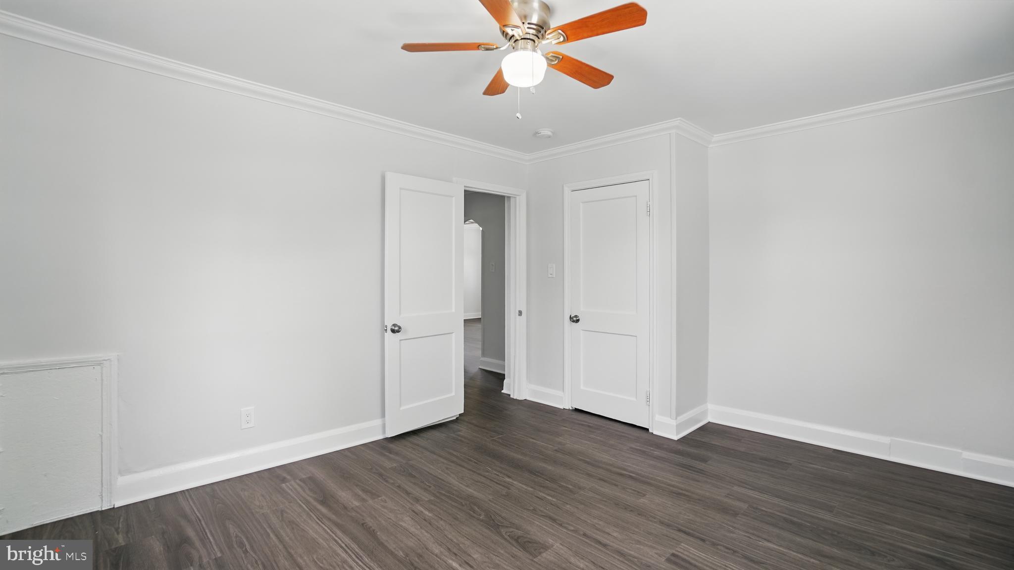 8014 Ritchie Highway Pasadena, MD 21122 - Photo 19 of 38 a view of an empty room and wooden floor