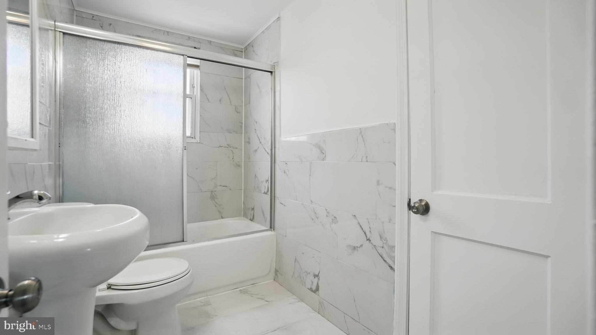 8014 Ritchie Highway Pasadena, MD 21122 - Photo 20 of 38 a bathroom with a toilet and shower