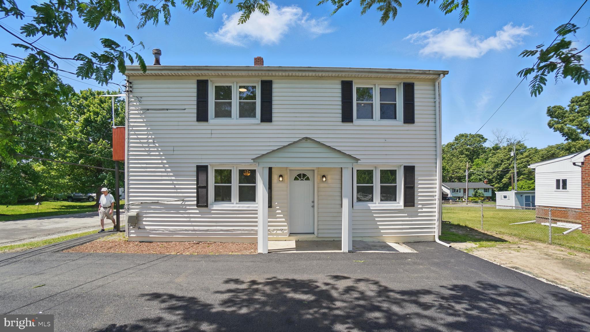 8014 Ritchie Highway Pasadena, MD 21122 - Photo 2 of 38 a view of a house with a yard
