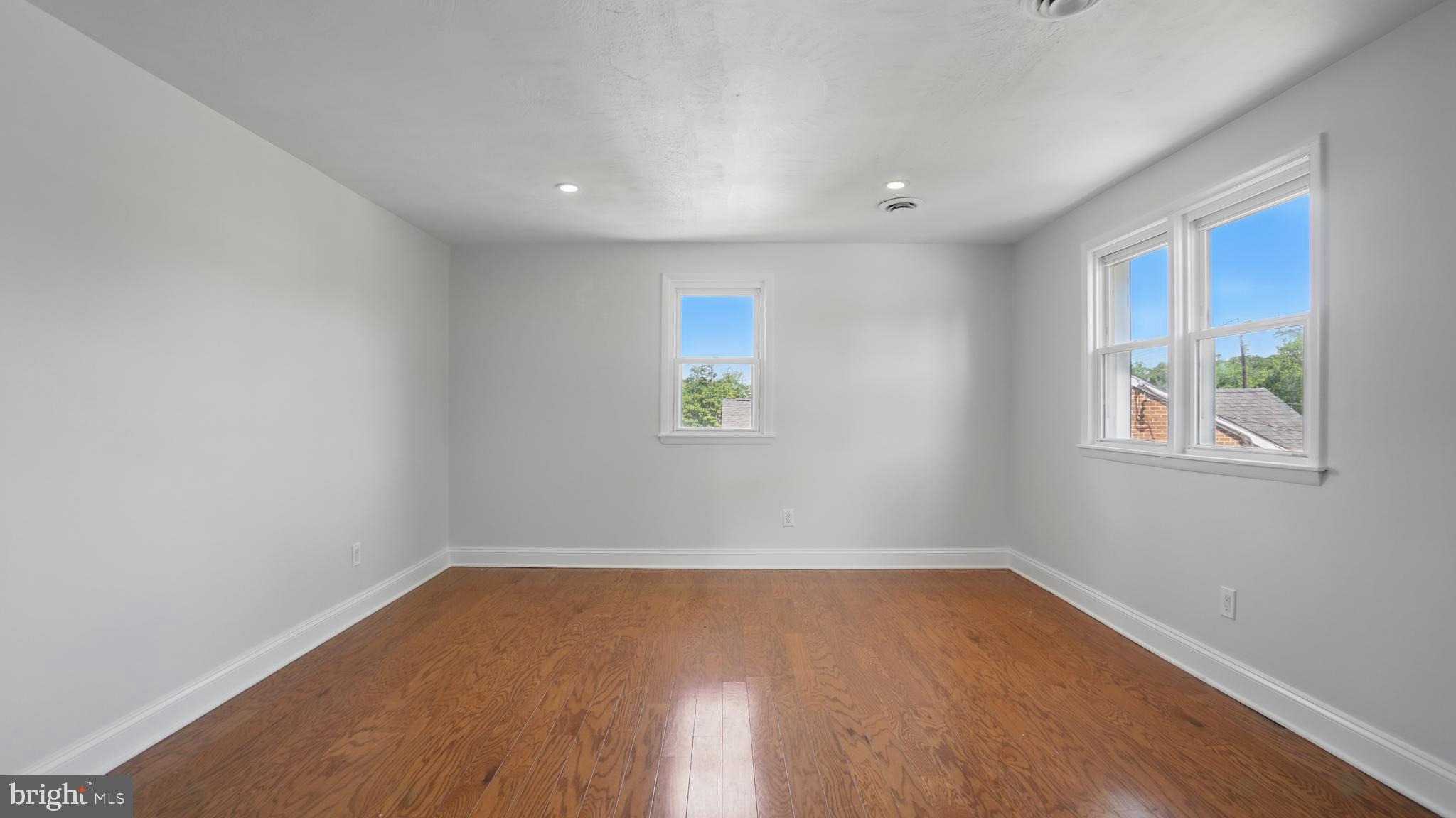8014 Ritchie Highway Pasadena, MD 21122 - Photo 25 of 38 a view of room with window and wooden floor