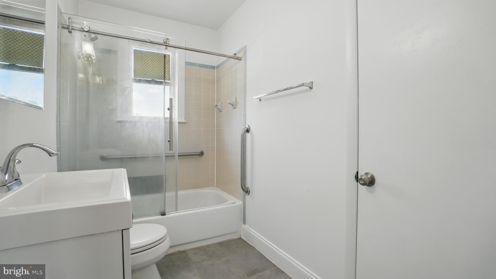 8014 Ritchie Highway Pasadena, MD 21122 - Photo 32 of 38 a bathroom with a sink toilet and shower