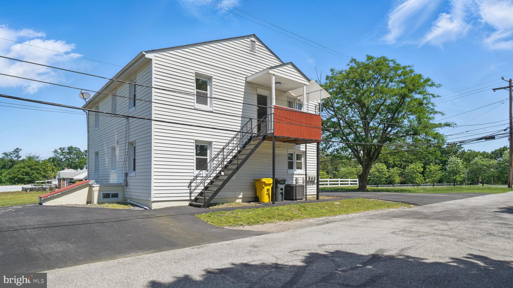 8014 Ritchie Highway Pasadena, MD 21122 - Photo 5 of 38 a front view of a house with a yard