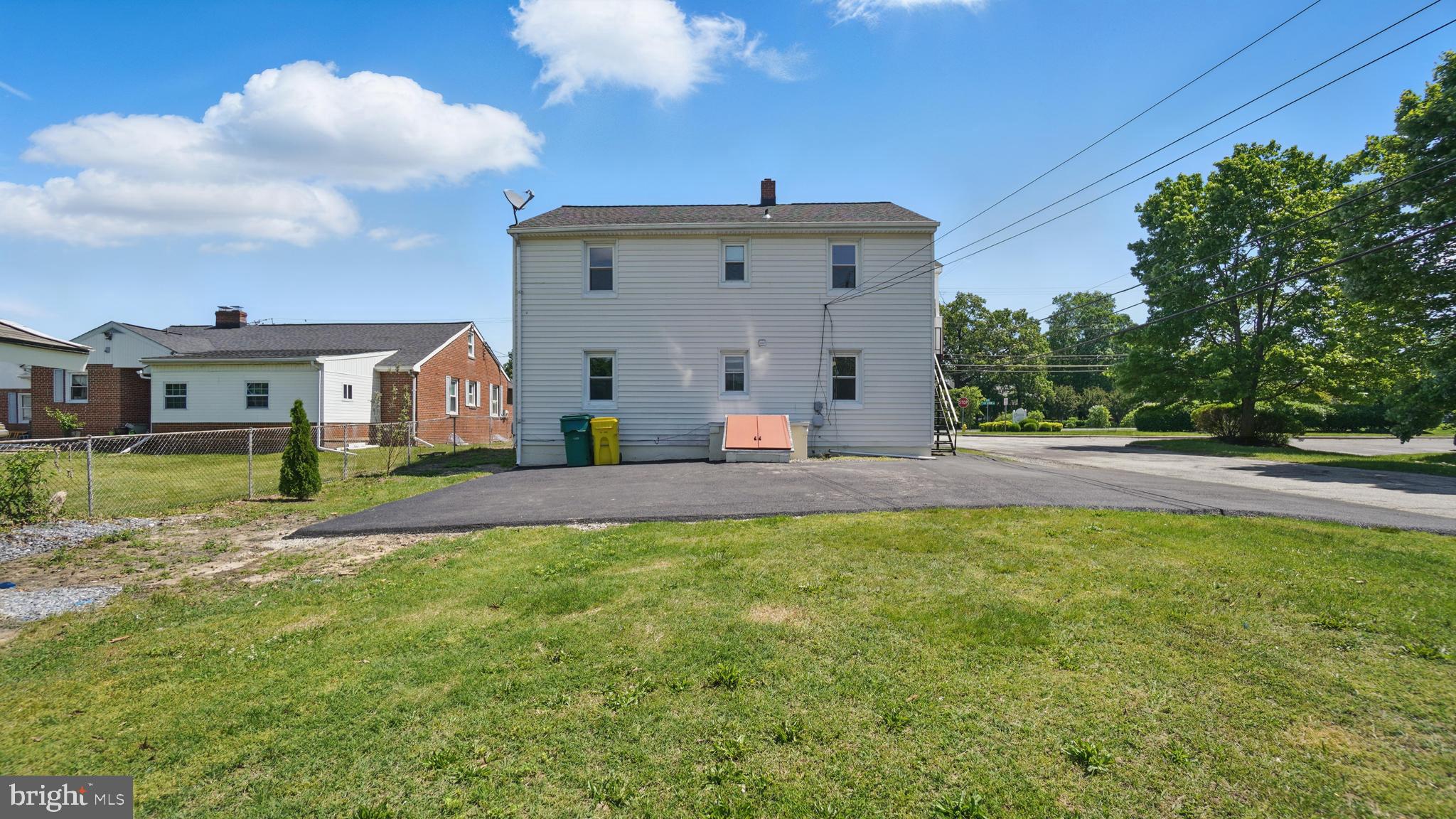8014 Ritchie Highway Pasadena, MD 21122 - Photo 7 of 38 a front view of a house with a yard