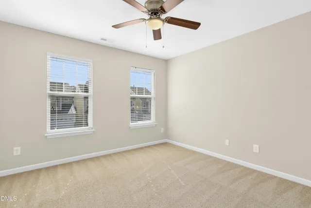 a view of a hallway with a staircase