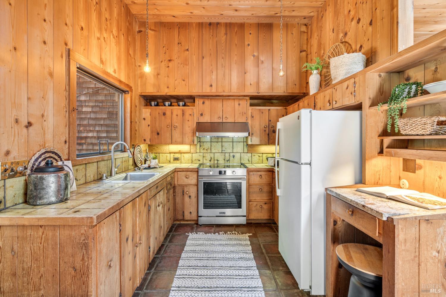 805 Wagnon Road Sebastopol, CA 95472 - Photo 17 of 56 a kitchen with a refrigerator and a sink