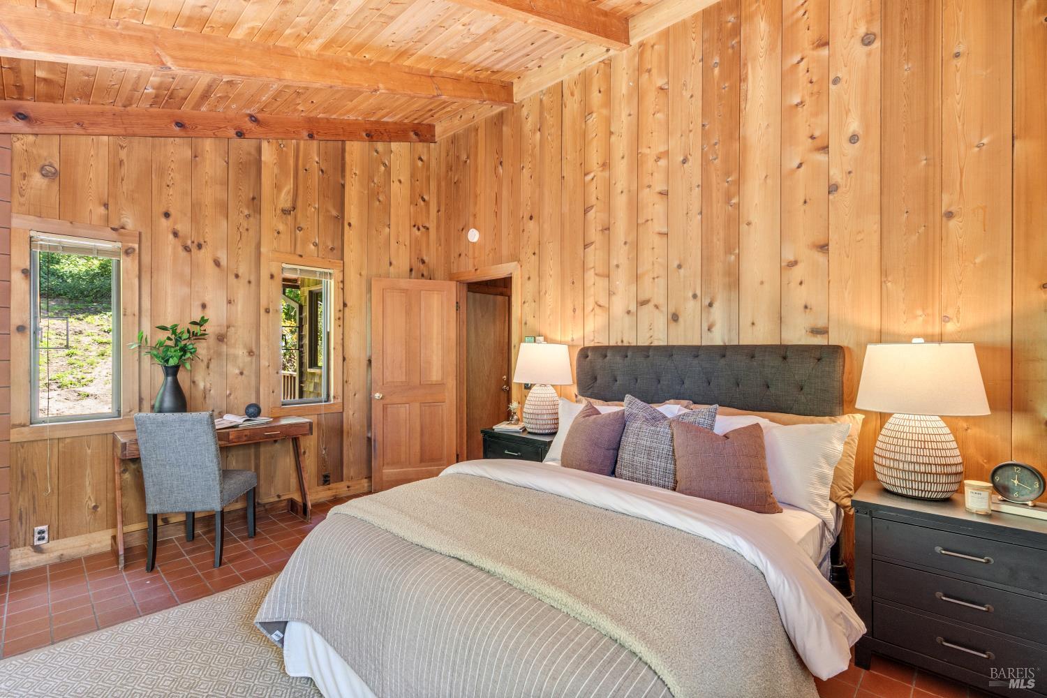 805 Wagnon Road Sebastopol, CA 95472 - Photo 31 of 56 a bedroom with a bed and wooden floor
