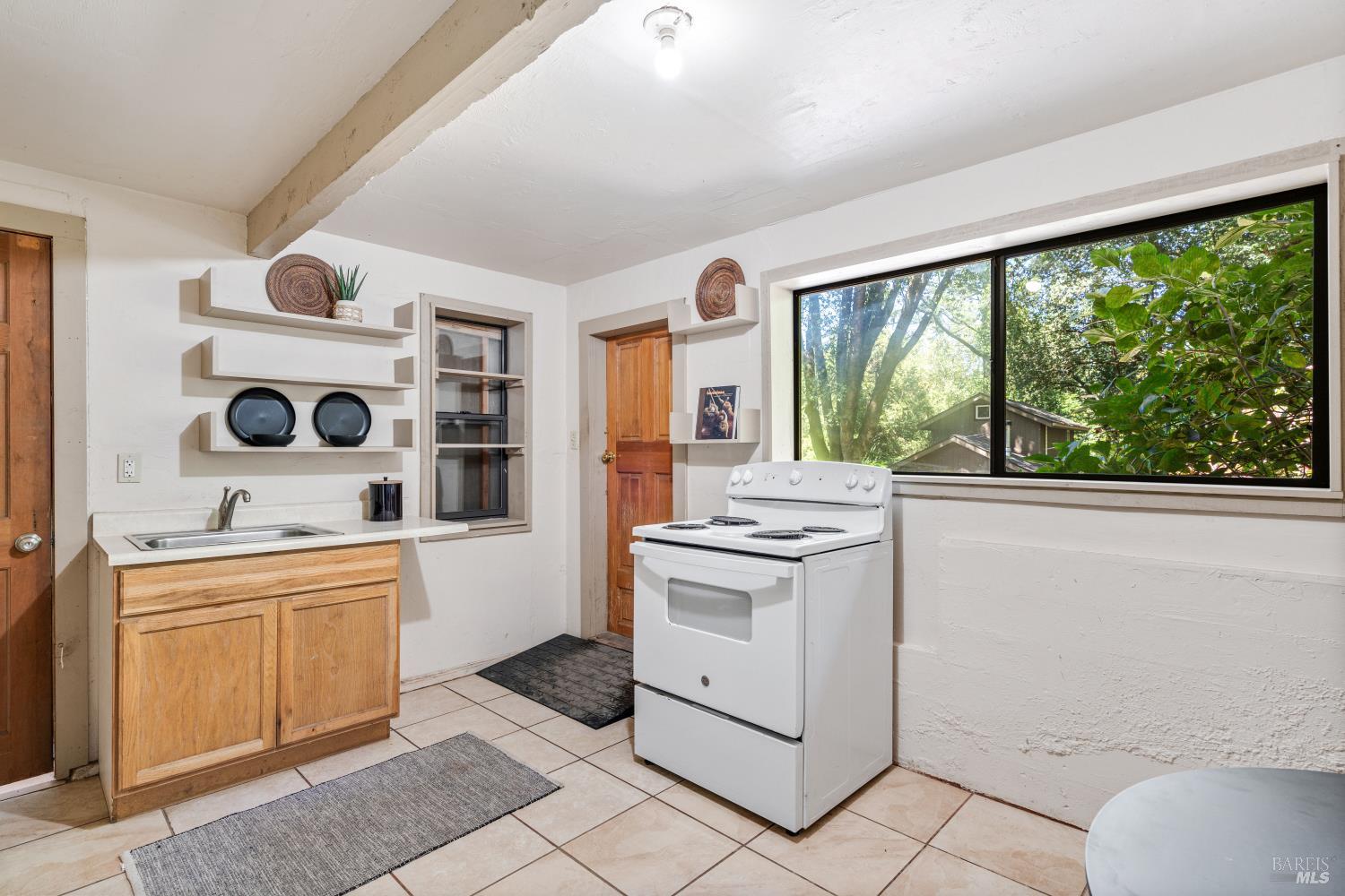 805 Wagnon Road Sebastopol, CA 95472 - Photo 39 of 56 a kitchen with a stove a sink and a refrigerator