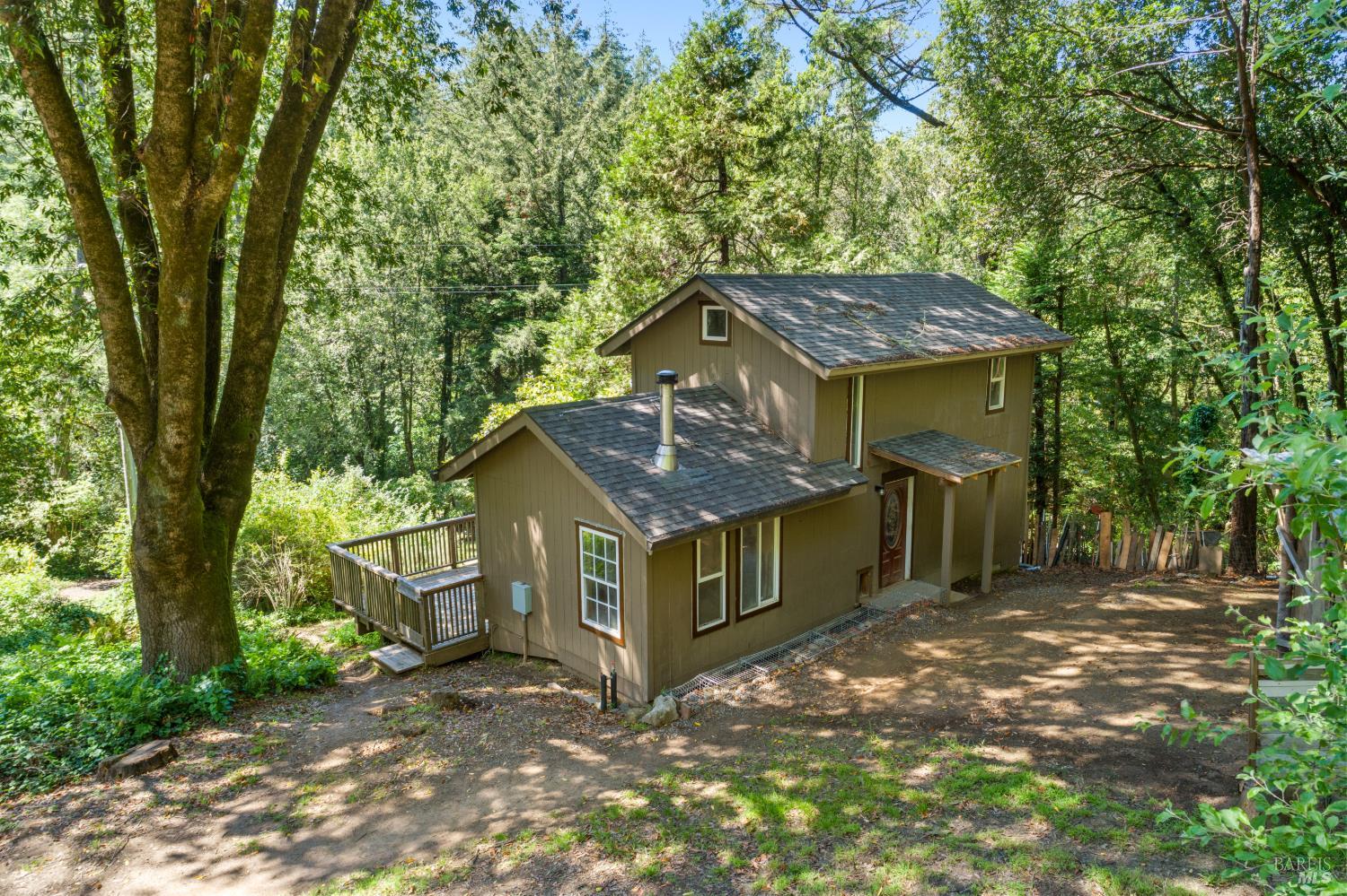 805 Wagnon Road Sebastopol, CA 95472 - Photo 44 of 56 a view of a house with a small yard and large tree