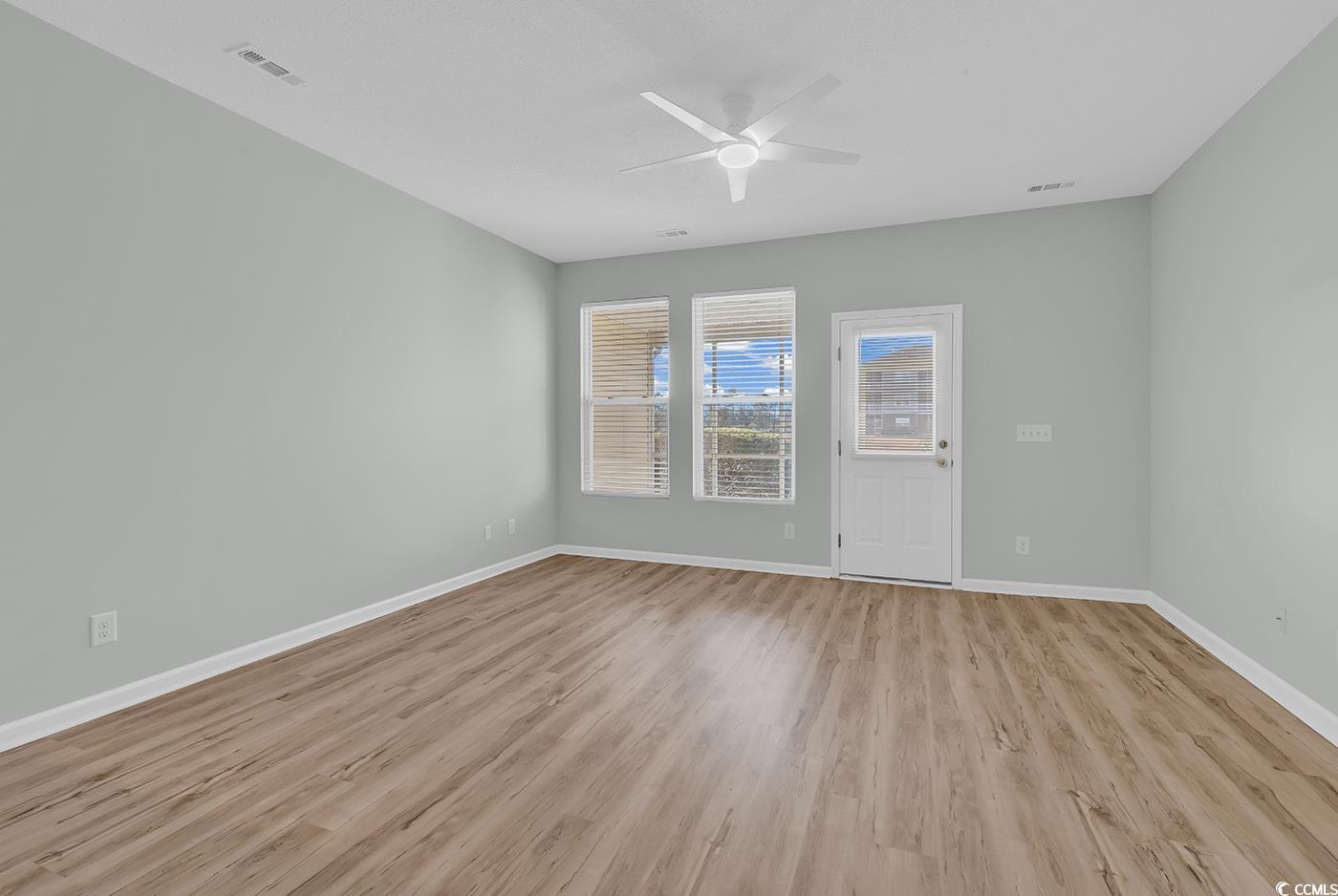 308 Kiskadee Loop, Unit E Conway, SC 29526 - Photo 12 of 36 Unfurnished room featuring light wood-style floors and a ceiling fan