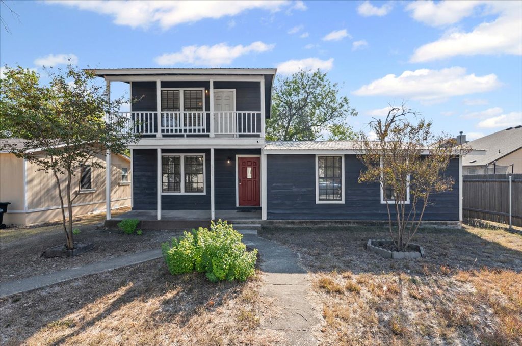 205 Cisneros Street Kyle, TX 78640 - Photo 17 of 17 View of front facade featuring a metal roof and a balcony
