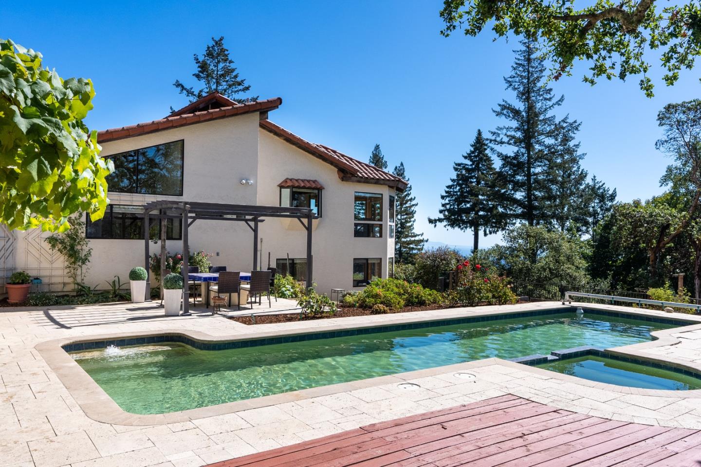 600 Ridge Top Road Los Gatos, CA 95033 - Photo 67 of 81 a view of a house with backyard sitting area and garden