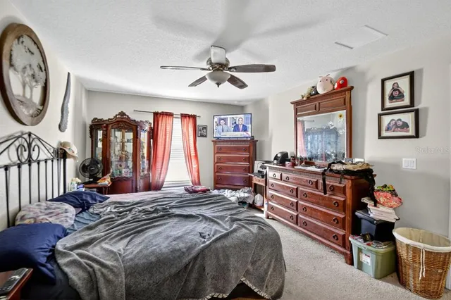 a bed room with a bed and a chandelier