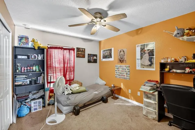 a living room with furniture workspace and a window