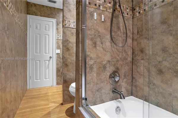 a bathroom with a sink and shower