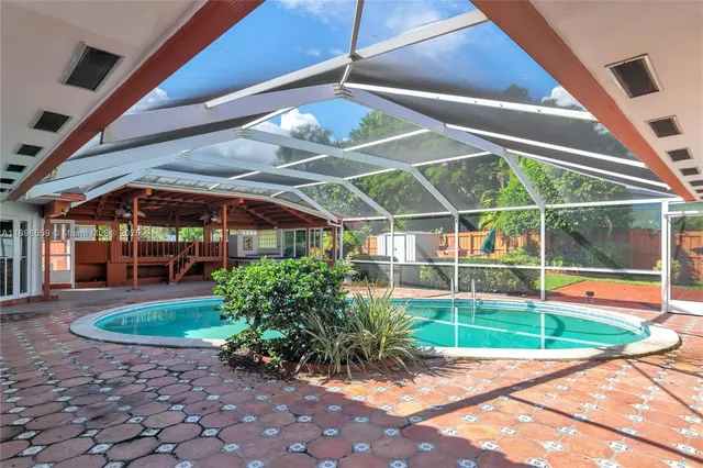 a view of a chairs and table in the patio