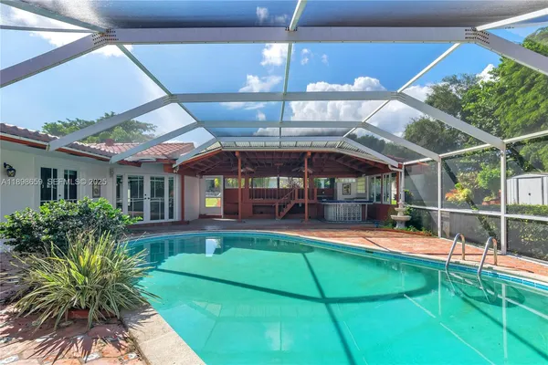 a view of a swimming pool with a patio