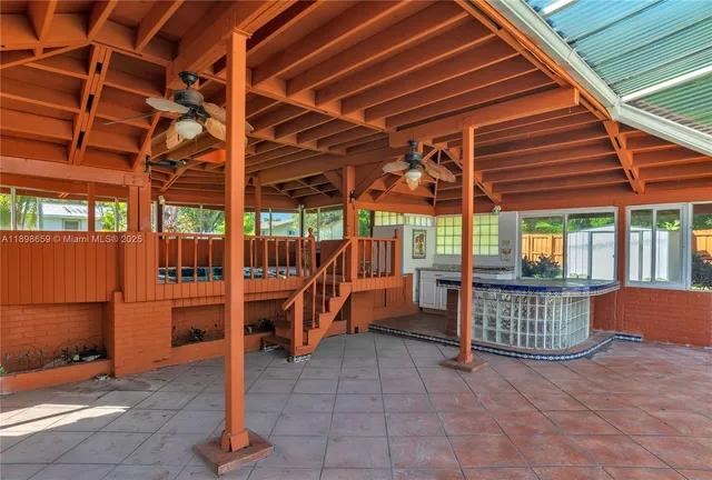 a view of a room with wooden deck and iron