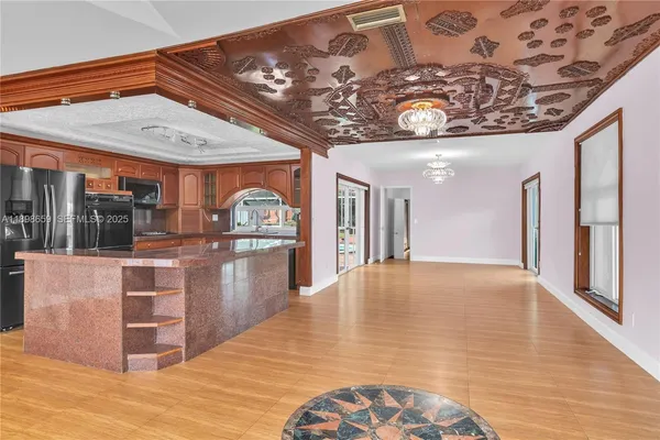 a view of a hallway with chandelier