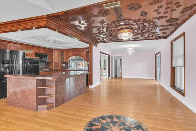 a view of a hallway with chandelier