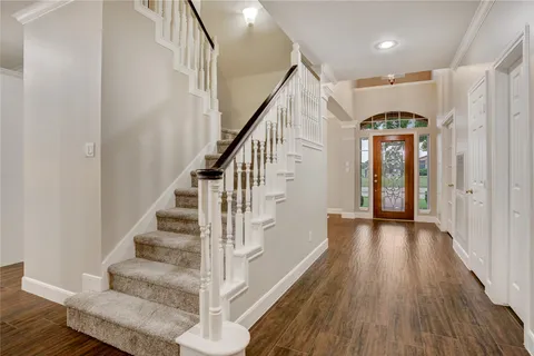 a view of staircase with wooden floor and staircase