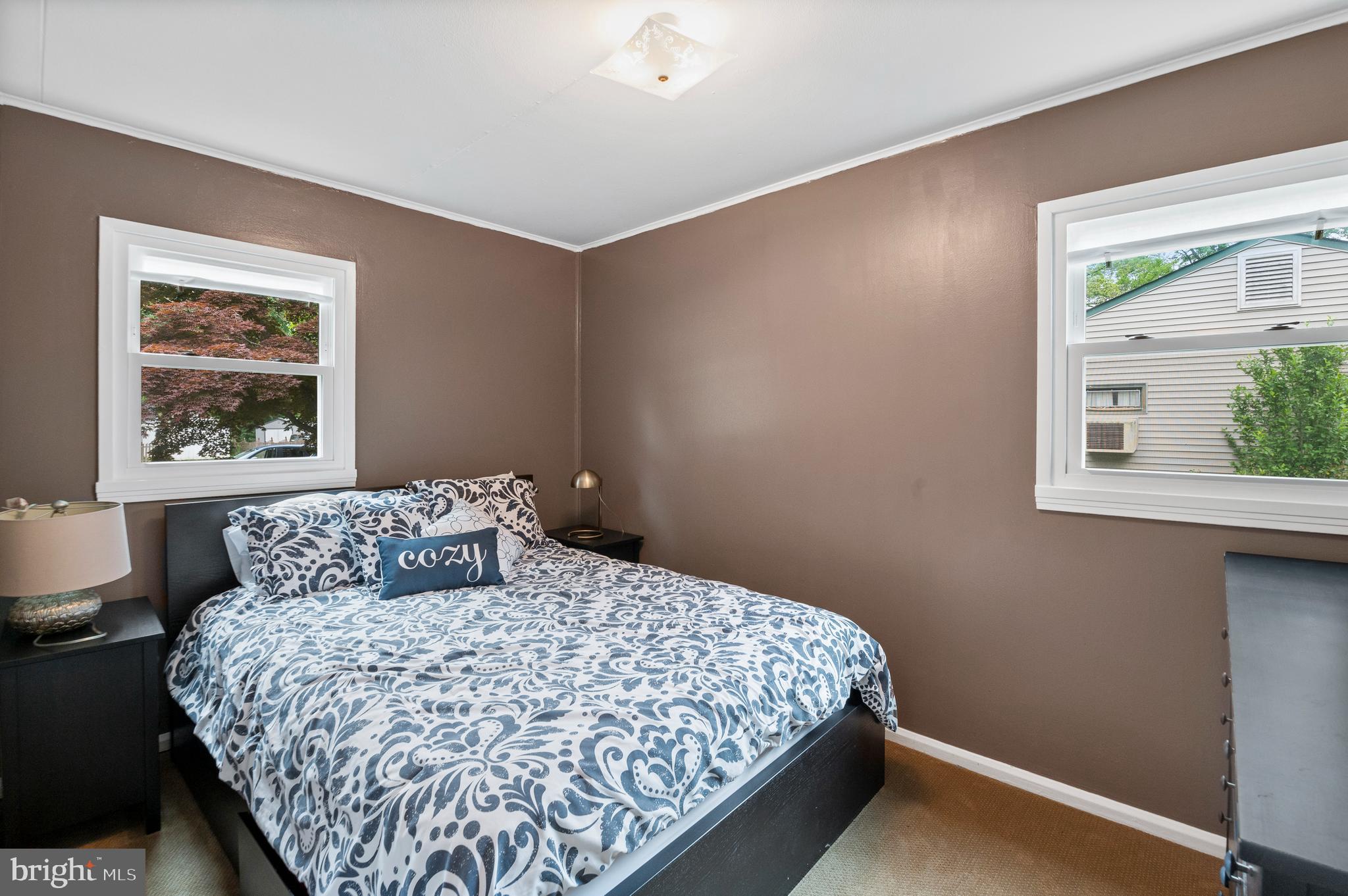 105 Manor Road Paoli, PA 19301 - Photo 16 of 30 a bedroom with a large bed and a window
