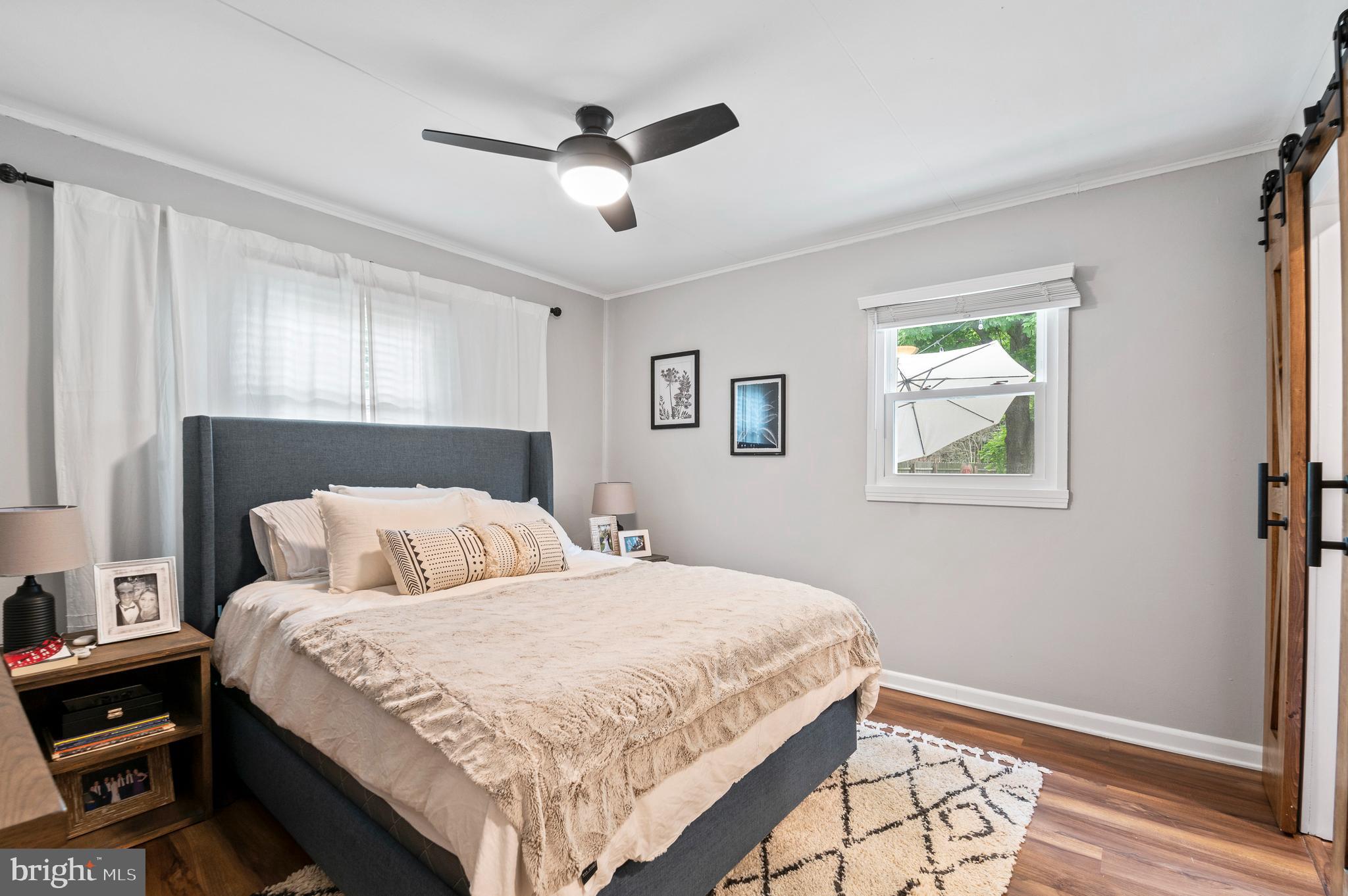 105 Manor Road Paoli, PA 19301 - Photo 19 of 30 a bedroom with a large bed and a window