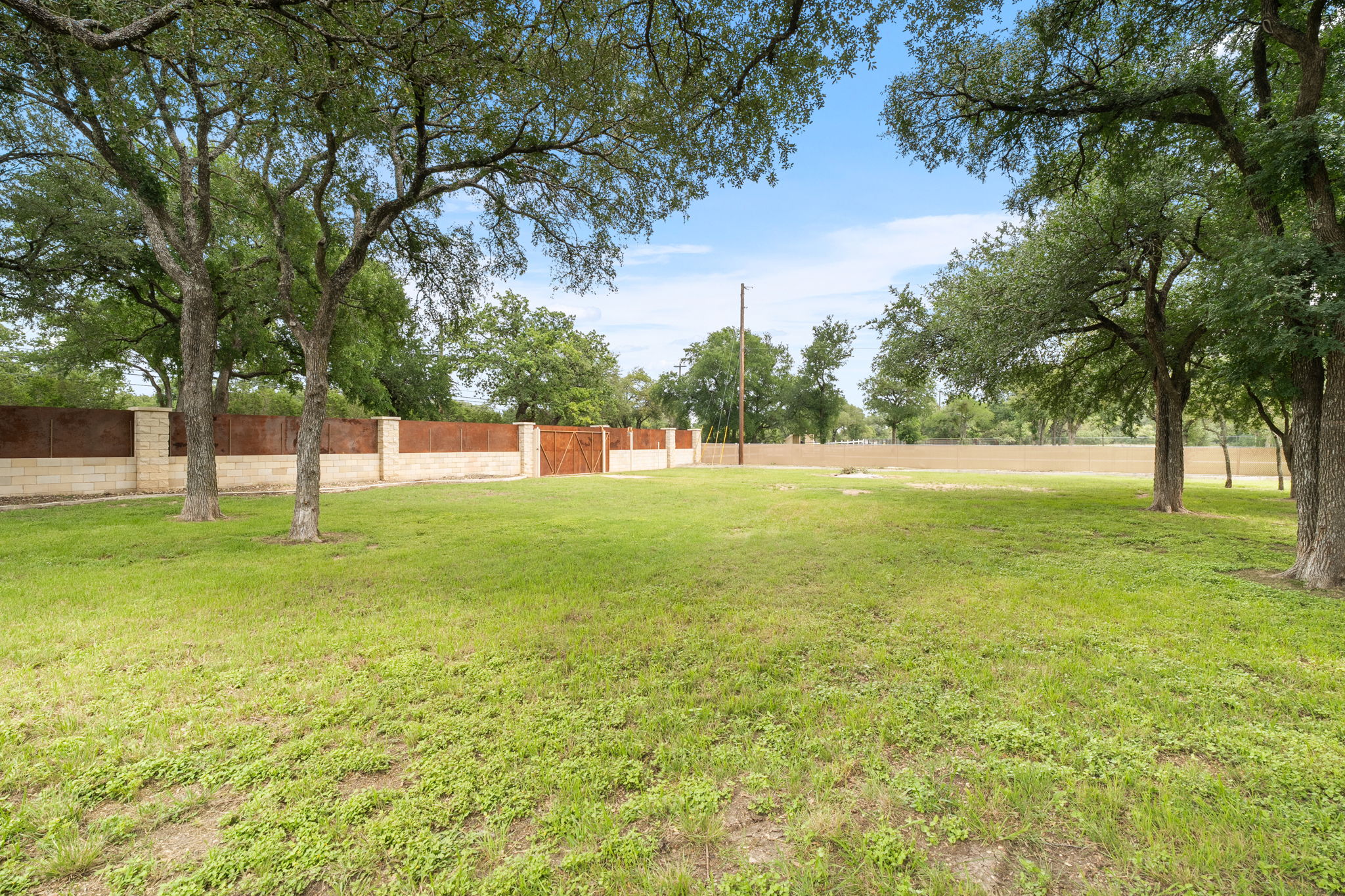 101 Landons Way Georgetown, TX 78633 - Photo 28 of 32 View of the fence with the additional vehicle entry, on the side of the property. Plenty of additional space