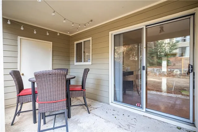 a view of a lake with boats and trees in the background
