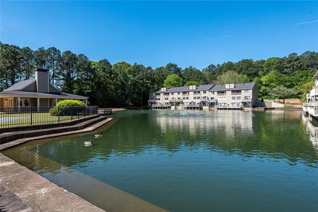 a view of a swimming pool with lounge chair