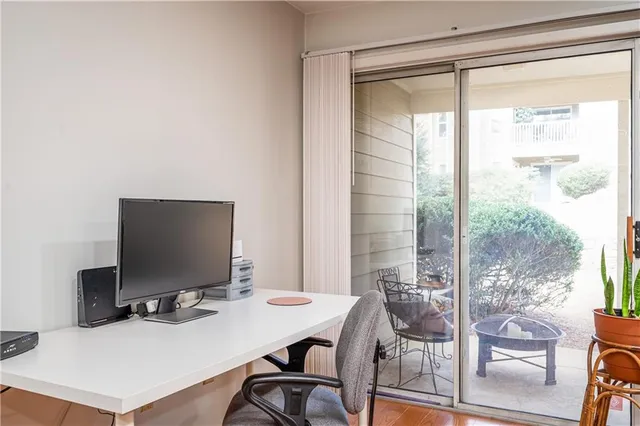 a view of a workspace with furniture